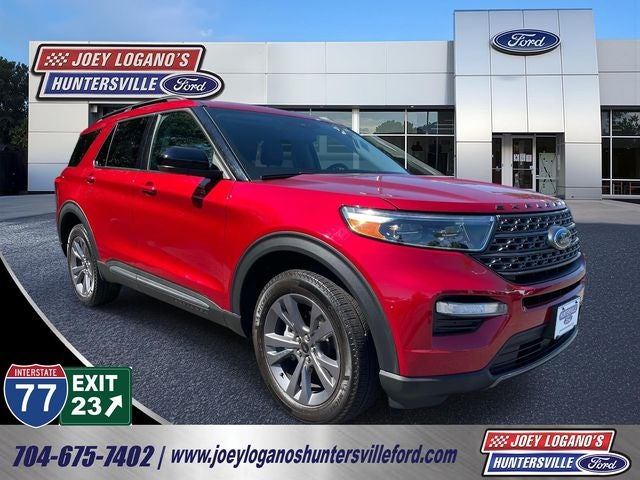2023 Ford Explorer XLT in Rapid Red Metallic Tinted Clearcoat — front three-quarter view