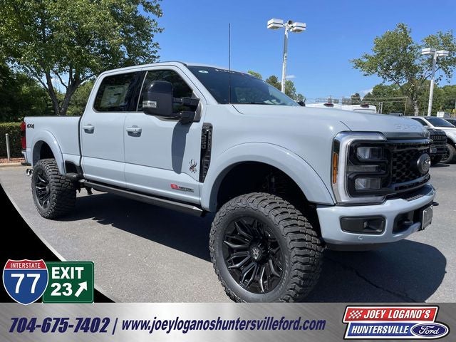 2026 Ford F-250SD Lariat BLACK WIDOW by FOX FACTORY in Glacier Gray Met Tri-Coat — front three-quarter view