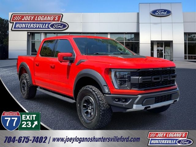 2023 Ford F-150 Raptor in Code Orange Metallic — front three-quarter view
