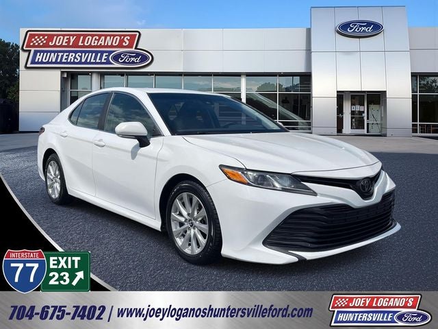 2018 Toyota Camry LE in Super White — front three-quarter view